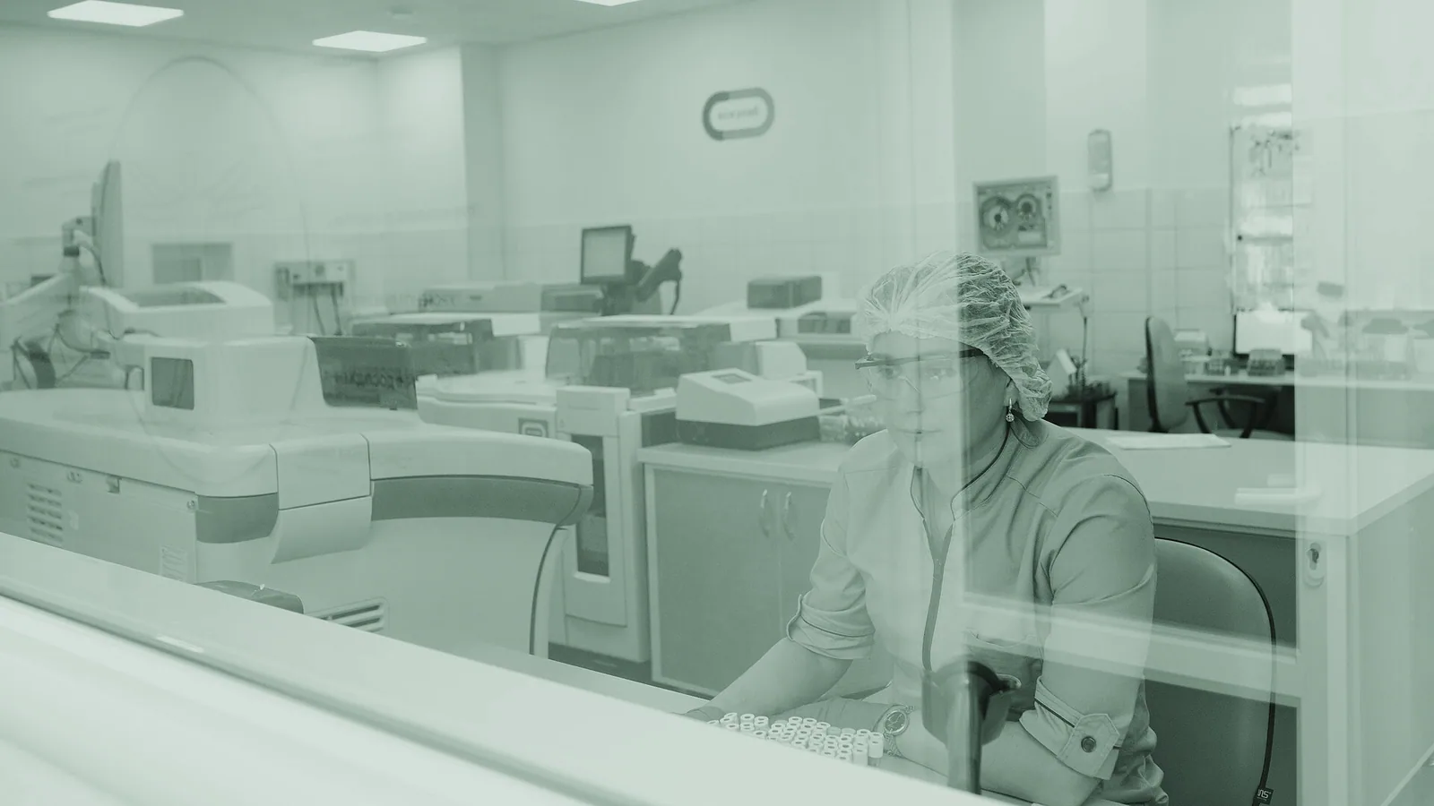 A scientist examining instruments in a modern laboratory.